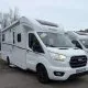 Camping-car Dethleffs blanc stationné sur un parking, modèle Just 90.